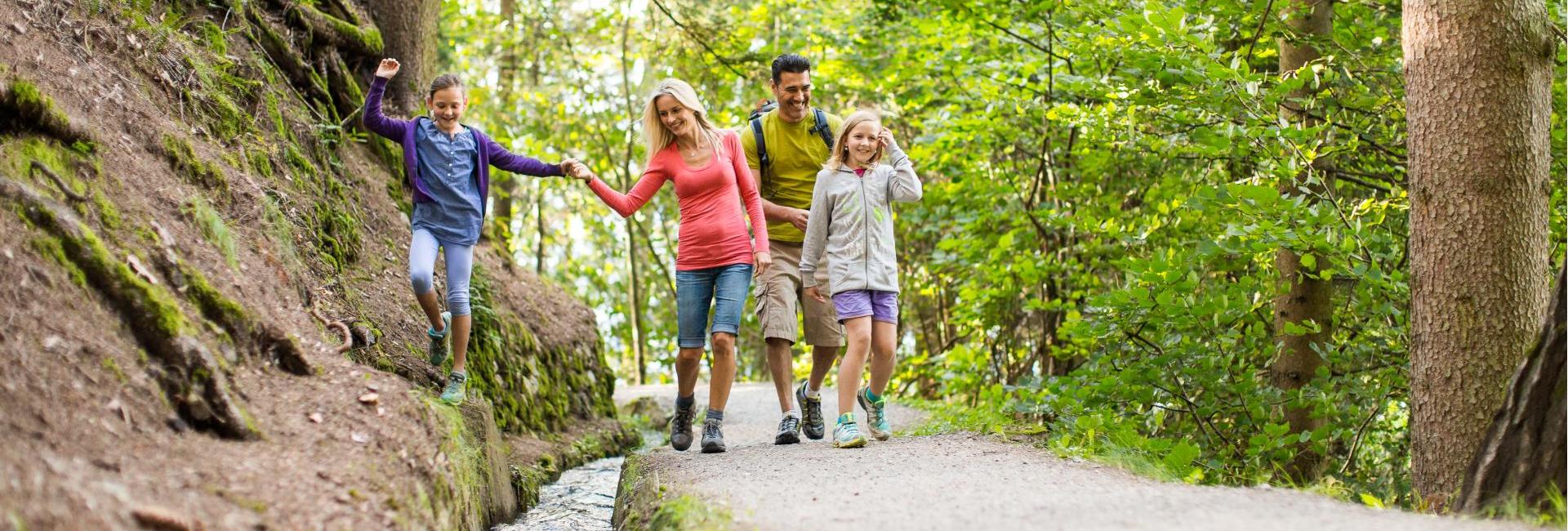 A family on an irrigation channel path